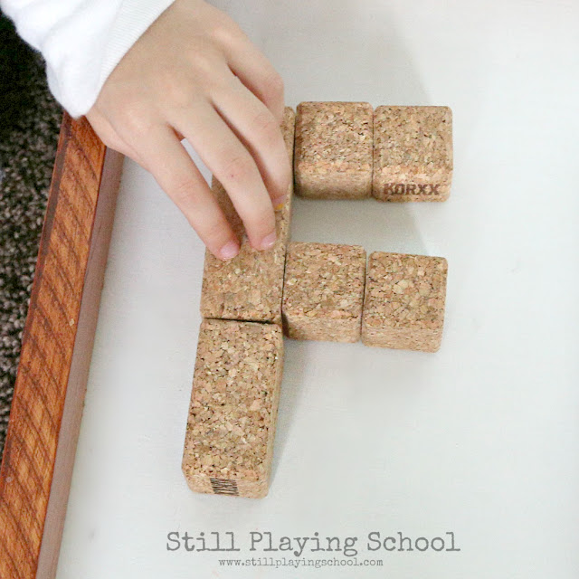 This literacy center invites kids to build letters with KORXX cork building blocks