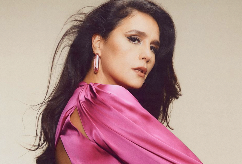 A shot from the photoshoot for Jessie Ware’s fifth studio album ‘That! Feels Good!’. Featuring Jessie in a pink silk blouse and her hair down.