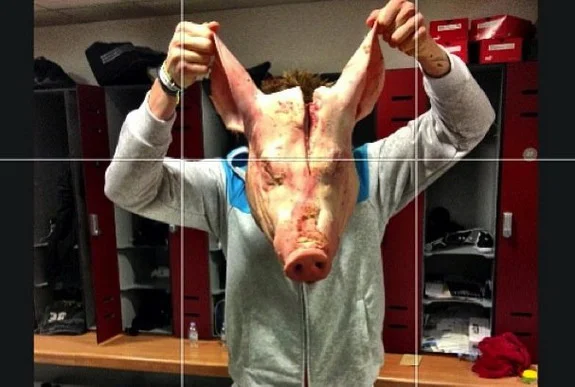 Brek Shea is seen holding the pig's head which offended Stoke teammate Kenwyne Jones