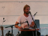 Switchfoot singer / guitarist Jon Foreman plays some kind of harp in the Nashville tent at the Revelation Generation festival, 2009.
