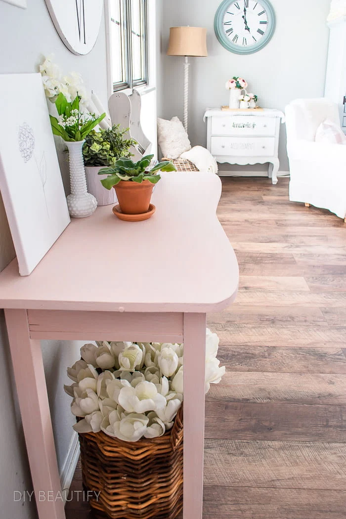 curvy pink vintage table with plants