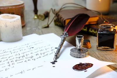 Quill, ink pot, and hand-writing