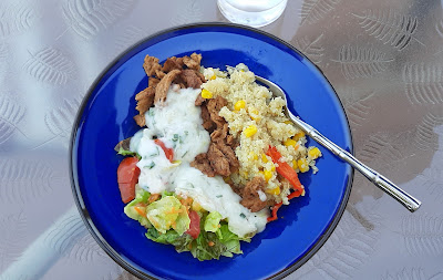 Plate of quinoa, salad, soy curls- Sun Oven meal