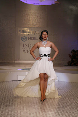 Sonakshi Sinha walking on ramp in white dress and diamond necklace