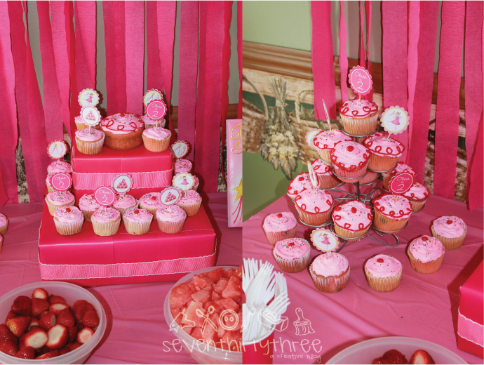  girl favors cupcakes and the Pinkalicious book complete the tablescape