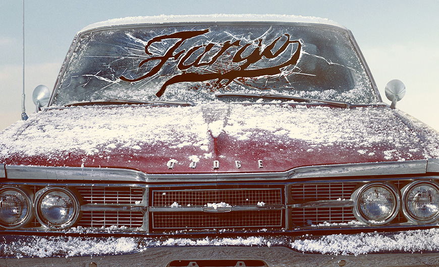 A red 1970s Dodge seen head-on, dusted by snow, with stylized 'Fargo' logo outlined in snow and cracked glass on its windshield