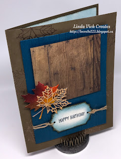 Linda Vich Creates: Colorful Seasons Birthday. Heat embossed copper leaves peak from beneath a dry embossed wood plank matte, topped with a square of Wood Textures DSP that is embellished with die cut leaves.