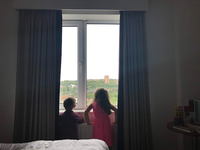 kids looking out hotel window in newcastle 