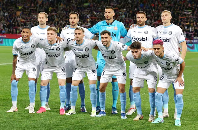 📸GIRONA F. C. 📆10 diciembre 2023 ⬆️Daley Blind, Eric García, Paulo Gazzaniga, David López, Artem Dovbyk. ⬇️Sávio, Viktor Tsygankov, Aleix García, Iván Martín, Miguel Gutiérrez y Yan Couto. F. C. BARCELONA 2 🆚 GIRONA F. C. 4 Domingo 10/12/2023, 21:00 horas. Campeonato de Liga de 1ª División, jornada 16. Barcelona, estadi Olimpic Lluis Companys: 42.848 espectadores. GOLES: ⚽0-1: 12’, Artem Dovbyk. ⚽1-1: 19’, Robert Lewandowski. ⚽1-2: 40’, Miguel Gutiérrez. ⚽1-3: 80’, Valery. ⚽2-3: 90+2: İlkay Gündoğan. ⚽2-4: 90+5’, Cristhian Stuani.