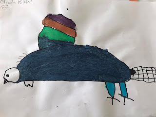 Elijah's observation's while drawing - "tuft - I din't notice, I need to do that.  He has a big head.  He has a big body and a long tail at the back. His claws look like thorns.  He has curly stripy white lines by his head and look he has these white feathers here".