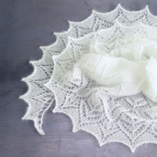 white mohair lace shawl curled on the floor