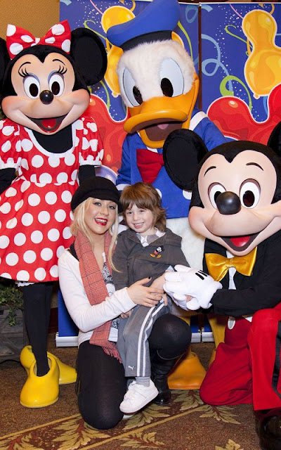 Christina Aguilera and Max celebrating at Disneyland