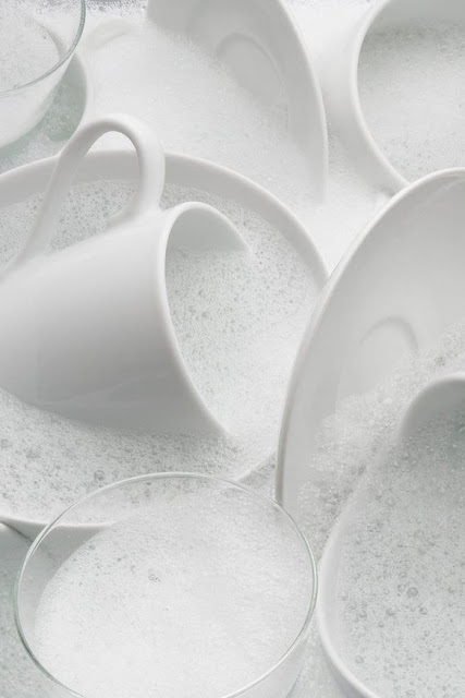 White porcelain ware in soapy water