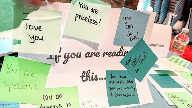 USU students wrote messages of support during the annual USU Connections Fair. (Photo credit: Courtesy of ENS Amber Barak, USU)