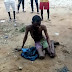 Yahoo Boy Caught Cleaning Someone's Urine With Handkerchief In Delta, Beaten To......