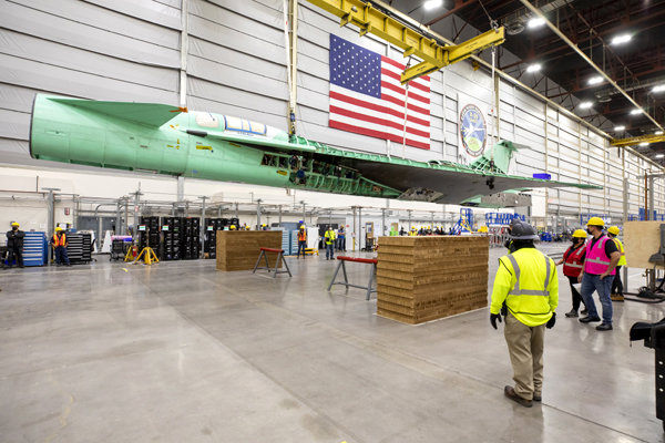 The fuselage for NASA's X-59 QueSST vehicle is lifted into the air at Lockheed Martin's Skunk Works facility in Palmdale, California.