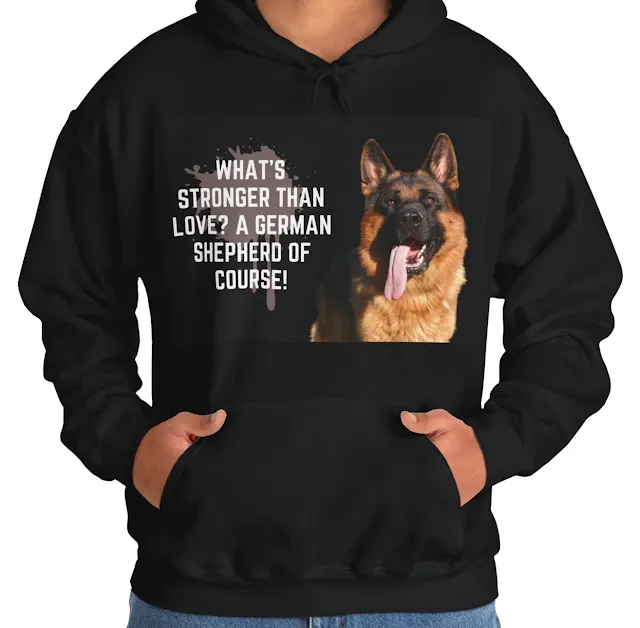A Hoodie With Large West Show Line Red and Black German Shepherd Leaving Tongue Out and Caption What's Stronger Than Love