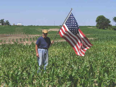 Photo of Keith, checking the corn on July Fourth.