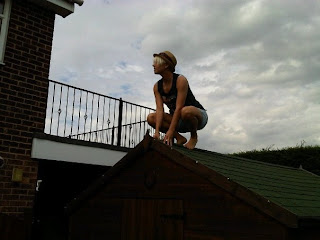 dude owling on the roof