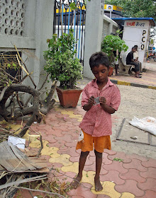 small boy examining plastic thingie