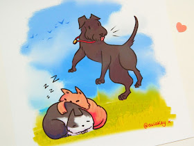 A photo of a custom pet art comission, featuring a black dog and two sleeping cats, one ginger, one black and white