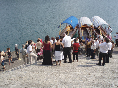 The wedding party disembarks from the gondolas