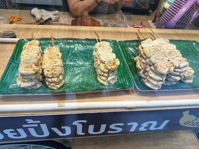 a grilled banana street food snack cart in Si Racha, Thailand (gluay ping)