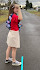 Young woman standing on a line and preparing to throw a straw like a javelin.