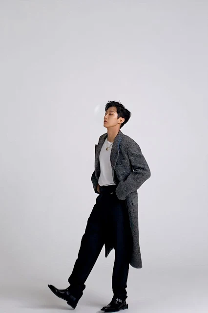 Jinyoung mix of t-shirt, chino pants, long coat, and loafers