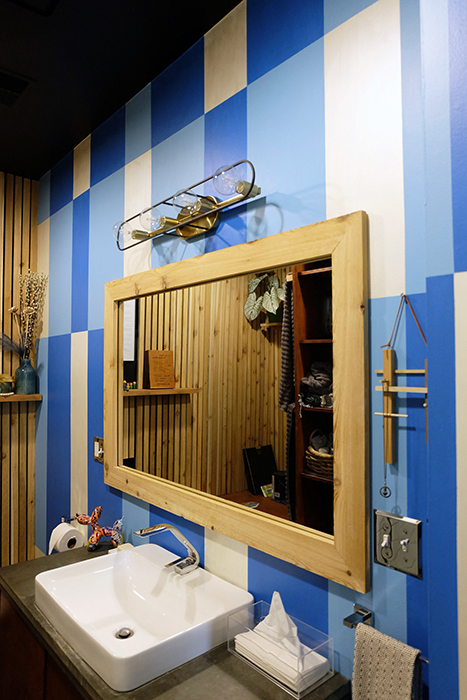 painted bathroom wall in grid pattern in blues