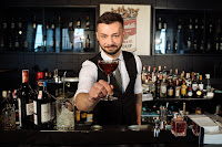 Photo by Antoni Shkraba: https://www.pexels.com/photo/a-bartender-holding-a-glass-of-cocktail-4485370/