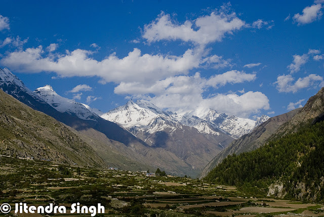 Kinnaur district of Himachal Pradesh is one of the most beautiful places and a great place to explore natural beauty with amazing culture. Jitendra is sharing a Photo Journey from Kinnaur this time. Check out this awesome series of Photographs from different parts of Kinnaur region in Himalayan State of India.Whenever we visualize Kinnaur, the very first thing comes into mind is route beyond Shimla which takes us to Kinnaur region. Kinnaur is connected through roads at very high altitude with deep valleys on one side and rocky mountains on other side. One of the most adventurous road trips in India are planned to Kaza throug various parts of Kinnaur like Kalpa, Rekong Peo, Sangla, Chango, Chitkul, Kothi, leo, lippa, Murang, Naco, Pooh, Rakcham, Ribba etc. Most of the Kinnaru region has beautifuk architecture, where we see amazing wooden houses which lasts for hundreds of year and a very good option for these folks who have to spend most of the year in snow or chilly weather. Kinnaur is one of the districts among 12 districts in Indian state of Himachal Pradesh. Kinnaur district is split into 3 body areas – Pooh, Kalpa, and Nichar. The executive headquarter of Kinnaur district is at ReckongPeo. Kinnaur, enclosed by the Tibet to the east, is within the northeast corner of Himachal Pradesh, regarding 235 kilometer from the capital, Shimla. Sangla Valley is full of orchards of apricots, peaches, chilgozas and apples.Most of the folks in Kinnaur are dependent on the fruit exports. very fine quality of Apple is produced in Kinnaur region of the country.Most of Kinnaur enjoys cold weather due to its high elevation, with long winters from October to May and short summers from June to September. The lower parts of the Sutlej Valley and the Baspa Valley receive monsoon rains. The upper areas of the valleys fall mainly in the rain-shadow area. These areas are considered to be arid regions, similar to the climate of Tibet. Jitendra has spend good time in villages of Kinnaur to understand real culture of the region and how these people live their life. And in states like Himachal, villages are best way to know about a particular geography. This holds good for India as well. India remain unexplored unless you visit villages in different regions like Himachal, Rajasthan, Maharashtra, kerala, North East etc.Zanskar which is a range of mountains and Dhauldhar is another one which enclose valleys of Sutlej, Spiti, Baspa and their tributaries. Kinnaur has beautiful landscape with apple orchards, forests, high hills with snow covered peaks and colorful houses. Spiritual Shivling lies at the height of Kinnar-Kailash Mountain. Hindustan-Tibet Road passes through the Kinnaur region on the bank of stream Sutlej and eventually enters Tibet at Shipki La passThese colorful landscapes with beautiful valleys and high mountains make Kinnaur a best place to spend summers. Climate is quite welcoming in summer, although seeing this place under white sheet of now during winters is altogether a different experience. Connectivity becomes of the issue during winters but it's worth planning fo it.Best way to explore Kinnaur is through own vehicle or hired vehicle, which gives you freedom of stopping anywhere anytime. but in that case, one needs to have control on stoppages as there are many beautiful landscapes on the way which my compell you to stop again n again and you may get late for better landscapes beyond the connectiing road. Road from Shimla to Kinnaur is quite adventurous. Usually tourists come to Shimla via Volvo or Train and then hire a local cab for further explorations.The present day Kinnauras do not constitute a homogeneous group and display significant territorial and ethnic diversity. For a better understanding of ethnic and cultural distribution, Kinnaur district may be classified into three territorial units. Lower Kinnaur comprise area between Chora at the boundary of the Kinnaur district with Rampur Bushahr and Kalpa including Nichar and Sangla valleys. The people of Lower Kinnaur are primarily of the Mediterranean physical type. It is difficult to distinguish them from the people residing in the adjoining Shimla district with whom they have some affinity. The people of lower Kinnaur are mostly Hindus though the ethno-historical factors have resulted in some Buddhist influence.The middle Kinnaur is the area between Kalpa and Kanam including Moorang tehsil. The people of middle Kinnaur are of mixed racial strain. Some have marked Mongoloid and others marked Mediterranean features. Many people have faith in both the religions.The upper Kinnaur comprises remaining north-eastern part of the district i.e. the area between Poo and Hangrang valley extending up to international border with Tibet. The predominant physical type of upper Kinnaur in the Mongoloid though a few persons with Mediterranean features are also seen in the area around Poo. However the people of Hangrang valley are almost universally Mongoloids. They mostly follow Mahayana Buddhist religionKinnaur has some very important rivers - the Satluj, which divides Kinnaur almost in two equal parts. The Spiti is the second major river of the district. Ropa divides the district Kinnaur and Lahaul-Spiti and merges with Satluj near Shiasu. The Baspa river rises on the North-Eastern declivity of the Dhauladhar range. The Yolong also joins the Spiti river.