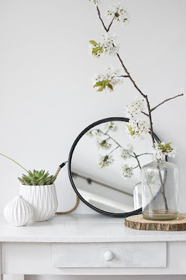 green plants, white walls, white furniture 