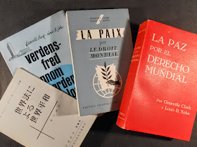 A set of four books in various languages.