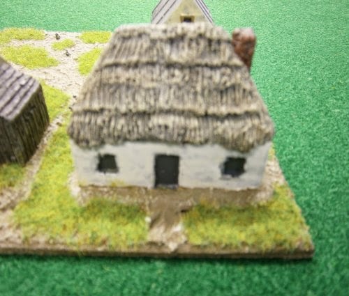 PS39 WWII Russian thatched hut, rendered walls