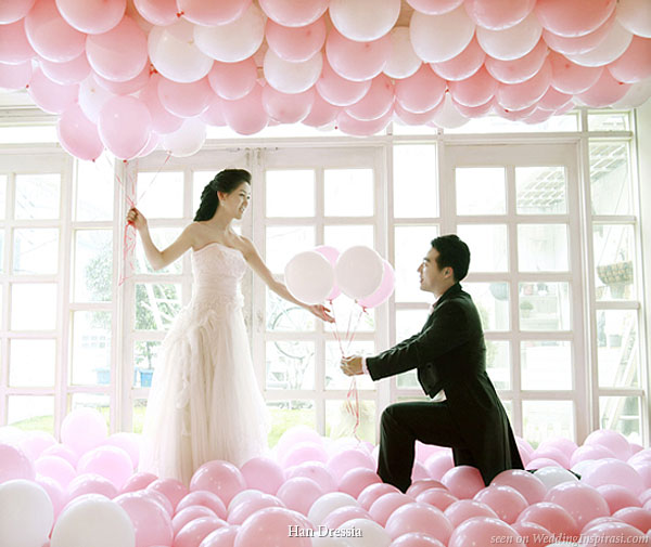  and ask him to create a large balloons with different wedding symbols 