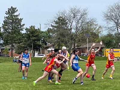 Picture of Calgary Kookaburras in red playing against the Etobicoke Kangaroos in blue.