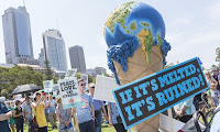 The ‘Delta 5’ argued that they acted out of ‘necessity’ to prevent greater harm of catastrophic climate change, an issue that has been the subject of rallies from Australia, pictured, to the US. (Photograph Credit: Claire Mahjoub/Demotix/Corbis  Click to Enlarge.