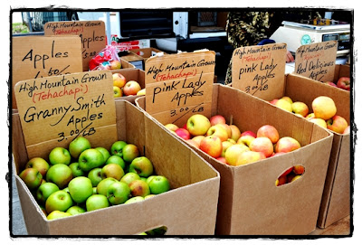 boxes of apples at farmer's market