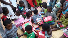 Children checking out their Operation Christmas Child shoeboxes in Zambia.
