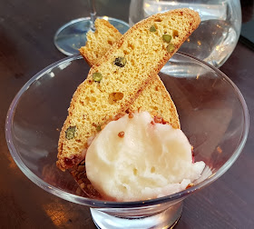 Capocci's Italian gelato review with pistacio biscotti in large glass 