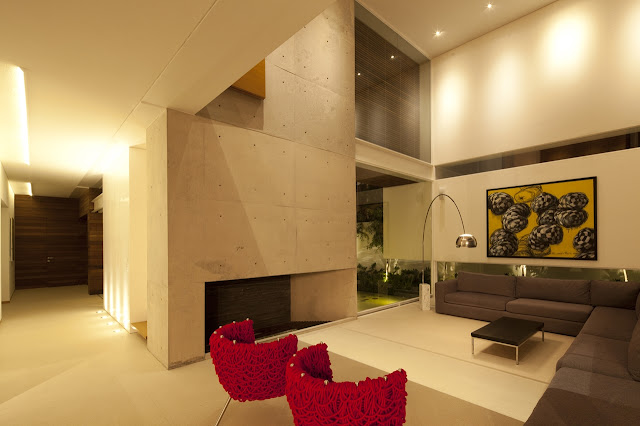 Modern living room of FF House in Mexico at night