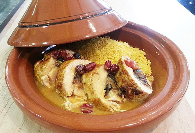 turkey with carrot couscous and rose petals in a tagine