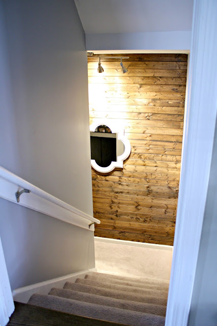 Stained wood wall on stairs