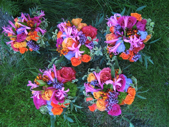 Closeup of one attendant bouquets below The attendants wore sage green 