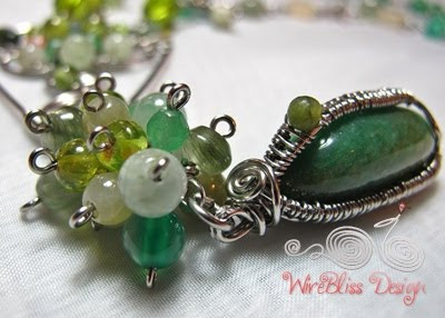 green adventurine wire wrapped pendant and beads cluster consisting of various gemstones - peridot, jade, rutile quartz and green agate.