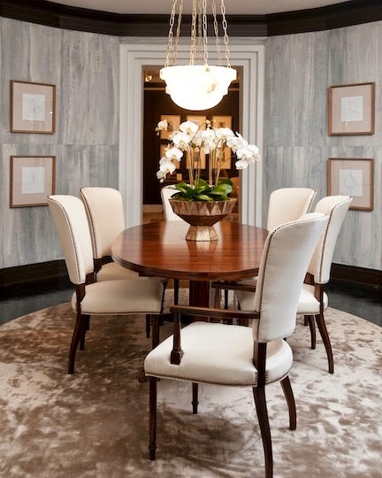 elegant dining room with gray striated walls round table