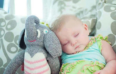 sleeping-baby-with-his-toy-walls-pics