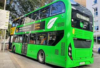 bus in Eyre Square, Galway with the bright yellow and green livery applied in 2020 to hybrid diesel/electric buses