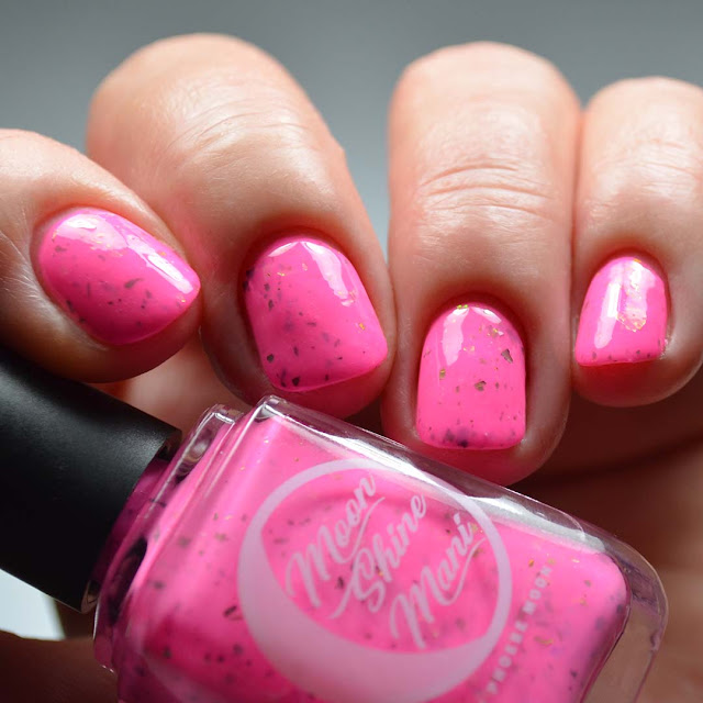 neon pink nail polish swatch with color shifting flakies swatch different angle